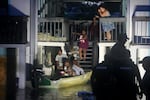 Residents are rescued from an their second story apartment complex in Clearwater that was flooded from and overflowing creek due to Hurricane Milton in Florida. Hurricane Milton felled trees, tore roofs off buildings, and flooded streets, leaving residents of the Florida coast surveying a trail of destruction in a state still reeling from another massive storm two weeks earlier.