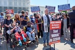 Activists with the Poor People's Campaign protest against spending reductions across Medicaid, food stamps and federal aid in President Donald Trump's spending and tax bill being worked on by Senate Republicans this week, outside the Supreme Court in Washington, Monday, June 2, 2025.