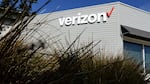 The Verizon logo is displayed on the exterior of a Verizon store. The FCC approved its $20 billion deal to buy Frontier Communications, a day after Verizon told the U.S. regulator that it would end many of its diversity-related policies.