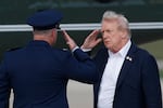 President Donald Trump, right, salutes Air Force Col. Christopher M. Robinson, Commander, 89th Airlift Wing, before boarding Marine One upon his arrival at Joint Base Andrews, Md., Friday, Sept. 26, 2025, after a day trip to the Ryder Cup golf tournament at Bethpage Black in Farmingdale, N.Y.