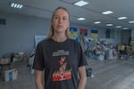 Kateryna Kyshkan, 36, fitness trainer from Mykhailivka, IDP and volunteer. Her teeshirt reads, "Our Russophobia is not enough."
