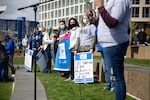 Supporters of PeaceHealth Southwest Medical Center nurses hold signs  during a rally at Vancouver's waterfront on April 10, 2021.