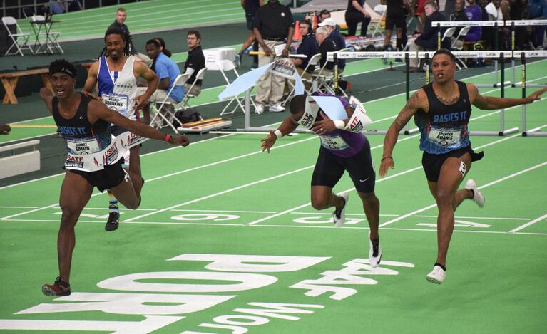 Jeffrey Porter gets caught in the tape after Jarret Eaton won the men's 60-meter hurdles at the USATF Indoor Championships in Portland on Saturday, March 12, 2016.