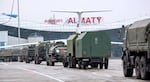 In this handout photo released by Russian Defense Ministry Press Service, vehicles of Russian peacekeepers leave an airport of Almaty, Kazakhstan, Sunday, Jan. 9, 2022. As Kazakhstan struggles to cope with an increasingly violent uprising this week, it has turned for help to a Russian-led security bloc, the Collective Security Treaty Organization. Thousands of Russian troops have now been dispatched to Kazakhstan to help secure strategic facilities.