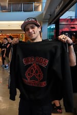 Harold Chaves shows off his "Section 305, The Panny Pack" sweatshirt on June 17, 2026, at the Moda Center in Portland, Ore.