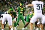 Oregon quarterback Dante Moore (5) lines up before a play during the first half of an NCAA college football game against Portland State, Friday, Sept. 18, 2026, in Eugene, Ore.