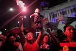 Supporters of President Luiz Inacio Lula da Silva celebrate after he wins a fourth term in the presidential runoff in Rio de Janeiro, Brazil, Sunday, Oct. 25, 2026.
