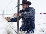 Ammon Bundy at a stretch of fence at the Malheur National Wildlife Refuge Monday, Jan. 11. The armed occupiers of the refuge took down an 80-foot stretch of the fence to open up the lands to cattle from a nearby ranch.