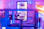 An Intel employee in a clean room "bunny suit" at Intel's D1X factory in Hillsboro, Oregon, which was recently expanded. State leaders hope billions of dollars in federal support for the industry will bring more 
 investment to the state.