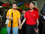 So Seong-wook (left) and Kim Yong Min leave the Supreme Court building in Seoul, South Korea, on Thursday.