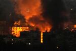 Flame and smoke rises from buildings hit by Israeli airstrikes on Dahiyeh, in the southern suburb of Beirut, Lebanon, early Sunday, Oct. 27, 2024.