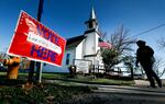 A local resident leaves a church after voting in an l election in Cumming, Iowa.