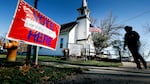 A local resident leaves a church after voting in an l election in Cumming, Iowa.