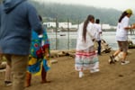 On a misty Sunday morning, Water Ceremony attendees gathered under the St. Johns Bridge in North Portland, as members of the Portland All Nations Canoe Family made their way to the shore.