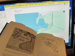 Historical maps left by Drake do bear similarities to Whale Cove, Ore. But they look like several other natural bays too.  Here, a print of a historic map is compared to a new online depiction, Jan. 21, 2025.