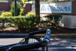 FILE - A grocery cart rests in a cart return area with a sign for Albertsons grocery store in the background on Aug. 26, 2024, in Lake Oswego, Ore.