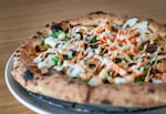 A bánh mì pizza served at Hapa Pizza in Beaverton, Ore. Other Asian-inspired pizza flavors at Hapa include phở, Thai yellow curry, and Korean burrata.