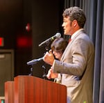 Joe Kent speaks to a debate audience at Lower Columbia Community College in Longview, Wash. on Oct. 2, 2024. Kent is the conservative challenger to incumbent U.S. Rep. Marie Gluesenkamp Perez.