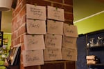 A wall of free meal options at Acorn Community Café, May 22, 2025.