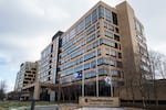 Flags fly at half mast outside the United Healthcare corporate headquarters in Minnetonka, Minnesota.  