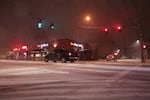 Cars drive through the intersection of Southeast 13th and Tacoma in Portland's Sellwood neighborhood during a snow storm on Tuesday, Jan. 10, 2017.