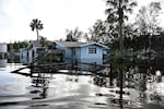 Floodwaters surround a home in the aftermath of Hurricane Helene on Friday in Crystal River, Fla.