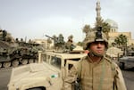 U.S. Marines take up positions in the area around the Palestine hotel in the center of Baghdad, April 9, 2003.