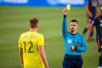 Alistair Johnston of Nashville SC is issued a yellow card during the second half of a match against FC Cincinnati at Nissan Stadium on April 17, 2021 in Nashville.