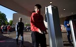 A Portland Trail Blazers fan scans a ticket on his phone before an NBA basketball game between the Trail Blazers and the Los Angeles Lakers in Portland, Ore., Friday, May 7, 2021. The game is the first fans have been allowed to attend at the Mora Center since the beginning of the coronavirus pandemic.