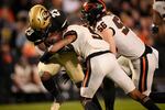 Colorado running back Jarek Broussard (23) is stopped by Oregon State defensive back Alex Austin (5) and linebacker Riley Sharp (56) in the second half of an NCAA college football game Saturday, Nov. 6, 2021, in Boulder, Colo. Colorado won 37-34 in double overtime.