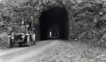 The Historic Columbia River Highway was built in the first half of the 20th century to give new motor car enthusiasts beautiful vistas like those that can be seen from the Mitchell Point Tunnel shown in this undated photo.