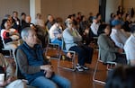 Seniors listen to a presentation on aging and loneliness at the Asian Health and Service Center in Portland, Ore., on May 21, 2026. The center offers daily programming for seniors.