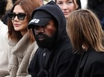 Ye (C), formerly known as Kanye West, attends the Givenchy Spring-Summer 2023 fashion show during the Paris Womenswear Fashion Week, in Paris, on Oct. 2, 2022.