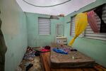 Nelson Cirino's home stands with its roof torn off by the winds of Hurricane Fiona in Loiza, Puerto Rico, Sunday.