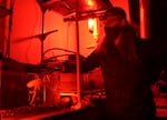 Dominic Sivitilli, a Ph.D. candidate at the University of Washington, interacts with an octopus named Lizbeth in a lab in Friday Harbor, Wash.