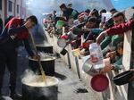 Palestinians line up for a free meal in Rafah, Gaza Strip, on Wednesday, Dec. 20.