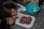 Amani Zeita prepares dinner at her home in the Palestinian village of Ein 'Arik in the occupied West Bank on March 24.
