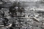 August 10: An aerial image shows destroyed homes and buildings burned to the ground in Lahaina.