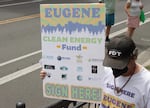 Eugene Clean Energy Fund supporters march through downtown Eugene, July 21, 2026.