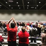 The crowd at  public meeting in Tacoma rises when asked to stand if they oppose the proposed methanol refinery.