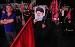 A man holds a poster of the late Iranian Supreme Leader Ayatollah Ali Khamenei in a gathering commemorating him at a square in Tehran on Saturday.