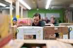 A volunteer sorts items for distribution at the Oregon Food Bank in Portland, Ore., Wednesday, Oct. 29, 2025.