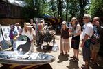 A man uses solar power to boil water in a demonstration within Energy Park.