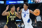 Creighton guard Blake Harper (2) drives against Oregon guard Jamari Phillips (24) during the first half of an NCAA college basketball game in the Players Era tournament in Las Vegas, Thursday, Nov. 27, 2025.