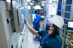 FILE: Intel employees in clean room "bunny suits" work at Intel's D1X factory in Hillsboro, Ore., in this provided photo.