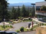 FILE--This Aug. 3, 2016, file photo shows the Central Oregon Community College campus with Mount Bachelor on the horizon in Bend, Ore.