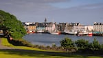 Stornoway Harbour, showing houses on water, Isle of Lewis