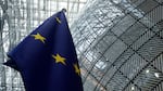 The European Union flag stands inside the atrium at the European Council building in Brussels, June 17, 2024.