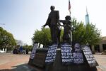 Signs in front of the Martin Luther King Jr. statue at the Oregon Convention Center in Portland on Aug. 12, 2017.