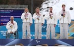 Joshua Sweeney, Oksana Masters, Sydney Peterson, Jake Adicoff and his guide Reid Goble of Team United States participate in the medal ceremony after the Para Cross-Country Skiing Mixed 4x2.5km Relay in Val di Fiemme, Italy